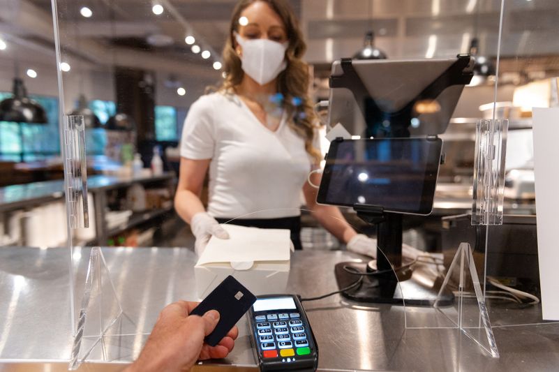 iStock-1225139972_Sneeze Guard_6 A store transaction